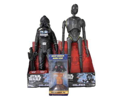 A collection of Star Wars memorabilia, to include: - Darth Vader Pig Wacky Wobbler Bobble Head - TIE Fighter large figure - K