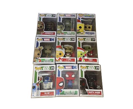 A collection of Christmas edition Funko Pop! vinyl figures in protectors: 279: Darth Vader 397: Spider-Man 276: C-3PO 399: Gr