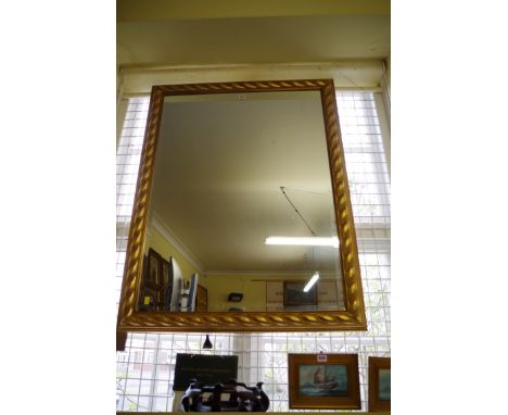 A large modern gilt framed wall mirror,&nbsp;115 x 89.5cm. 
