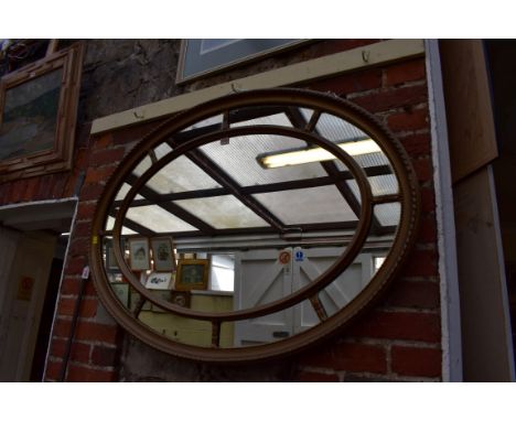 A Victorian gilt oval wall mirror, 81.5 x 113cm.&nbsp; 