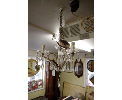 A glass three branch ceiling light.&nbsp; 