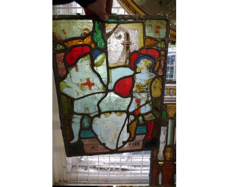A collection of seven 19th century Swiss stained and leaded glass panels, the largest decorated to the centre with a portrait