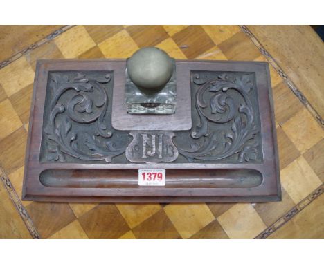An early 20th century carved wood inkwell,Â&nbsp;30.5cm wide. 