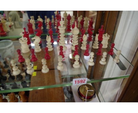 A late 19th century bone chess set,&nbsp;red stained and natural, king 9.1cm, pawn 3.5cm. 