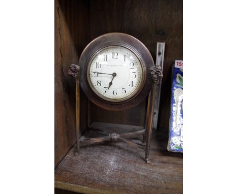A neo classical style bronze timepiece, the enamel dial inscribed 'Boyes Bassett &amp; Co, Shanghai', 22.5cm high.&nbsp; 