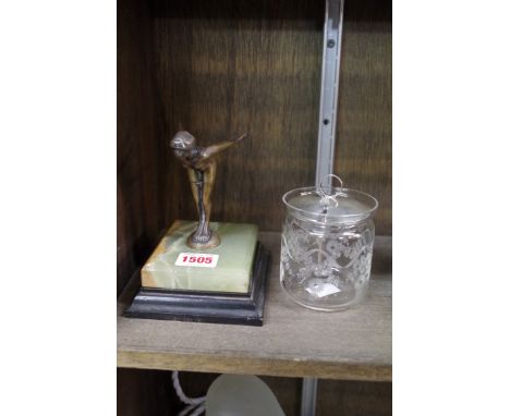 An Art Deco bronze figure of a female swimmer, on green onyx and ebonized wood base, total height 14cm; together with a silve