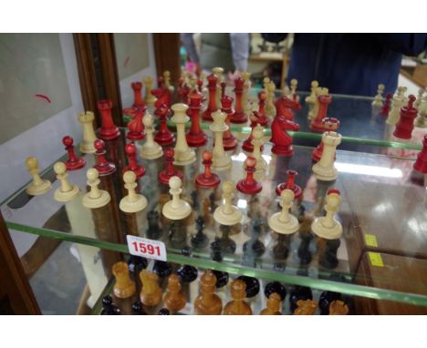 A late 19th century bone Staunton pattern part chess set,&nbsp;red stained and natural, King 7cm high, Pawn 3.4cm high. 
