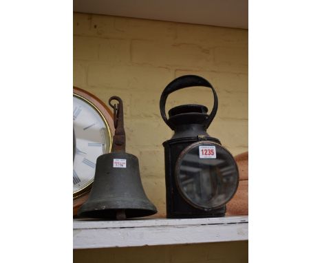 An old LMS railway lantern, labelled and numbered 44199;Â&nbsp;together with an old bronze handbell. 