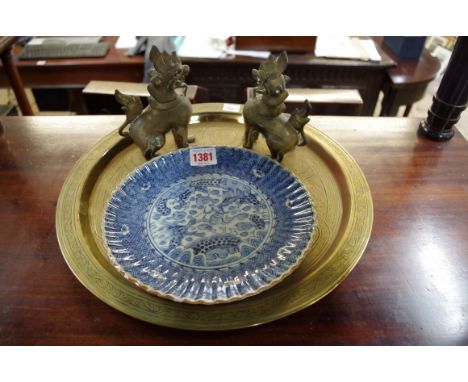 An Islamic brass circular tray,&nbsp;34cm diameter; together with a pair of Eastern bronze dragons; and a Japanese blue and w