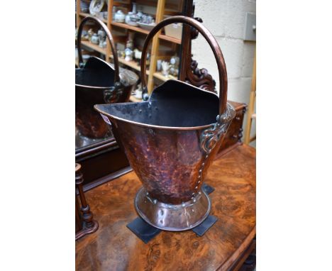 A good Hilton Ware Arts and Crafts copper helmet form swing handled coal scuttle,&nbsp;total height 52cm.&nbsp; 