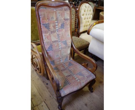 A late Victorian mahogany and button upholstered nursing type chair. 