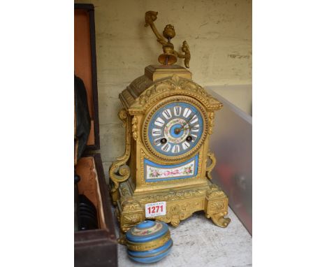 A 19th century gilt metal and porcelain mounted mantel clock.&nbsp; 