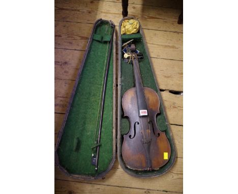 An antique Continental violin,&nbsp;labelled&nbsp;'Antonius Stradivarius...',&nbsp;with 14in back, with bow and ebonized wood