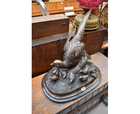 A large bronze figural group of a pheasant and chicks, on marble base, 46.5cm wide. 