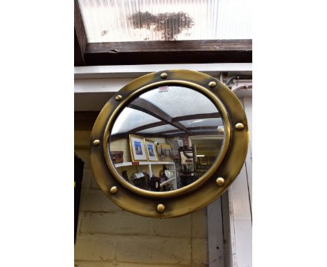 A modern lacqueredÂ&nbsp;brass circular wall mirror, 48cm diameter. 