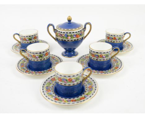 Wedgwood set of five coffee cans and saucers, and a twin handled sucrier with cover, all decorated with a band of fruits on a