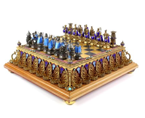 Fine late 19th / early 20th century Austro-Hungarian silver, silver gilt and enamel chess set and board, the board set with p