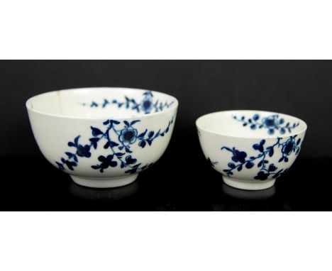 Two early Worcester blue and white tea bowls, crescent marks to bases, 10cm diam and 7.5cm diam