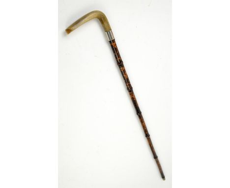 Late 19th/early 20th century swordstick, with carved horn handle and the cane sheath carved Oriental scenes, 84.5cm long,
