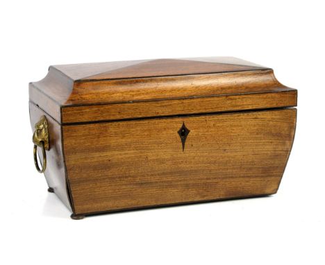 19th century mahogany tea caddy with central glass bowl flanked by removable caddy's, with brass lion paw handles on squashed