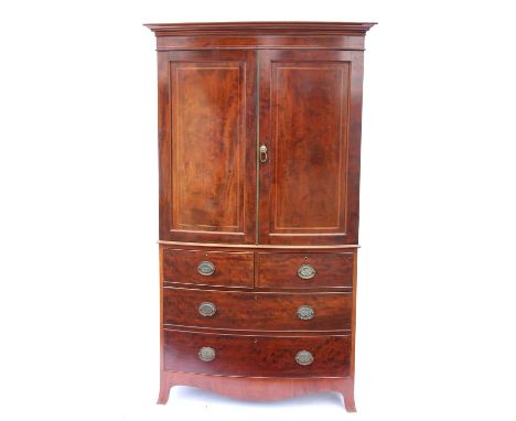 Late 19th / early 20th century inlaid mahogany bow fronted linen press, with plaque for Heal & Son to interior, the moulded c