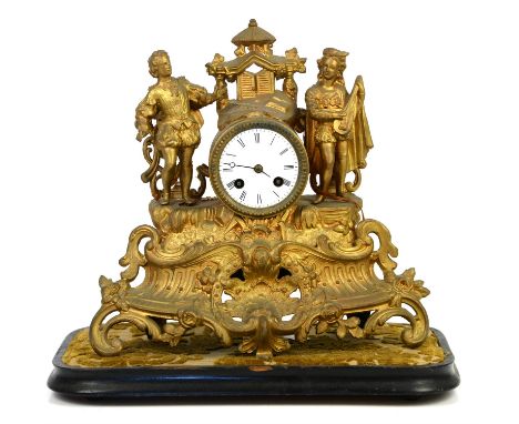 Late 19th century French gilt metal mantel clock, with musicians flanking white enamel dial with Roman numerals, on scrolling