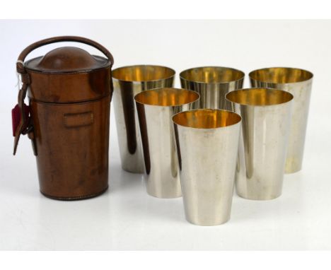 Nest of six picnic steel stacking beakers in brown leather case, the cups marked A & N for Army and Navy, case h18cm