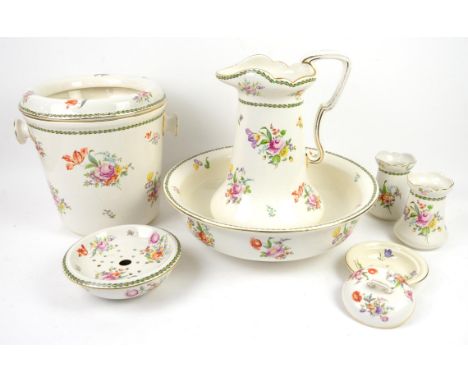 Victorian wash stand set with floral decoration on a cream ground, jug 36cm high, basin 41cm diameter, bucket 29cm highCondit