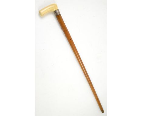 Late 19th century malacca swordstick with carved ivory handle and white metal mount, 82cm long,