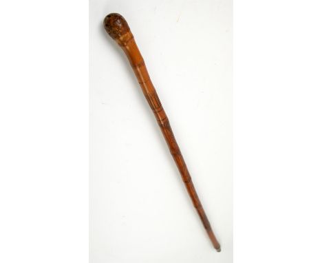 Early 20th century bamboo swordstick, the sheath carved with Oriental ladies, 93cm long,