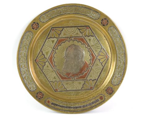 Early 20th century Jewish Damascene brass, copper and white metal dish, with scrolling decoration, single panel with Hebrew a