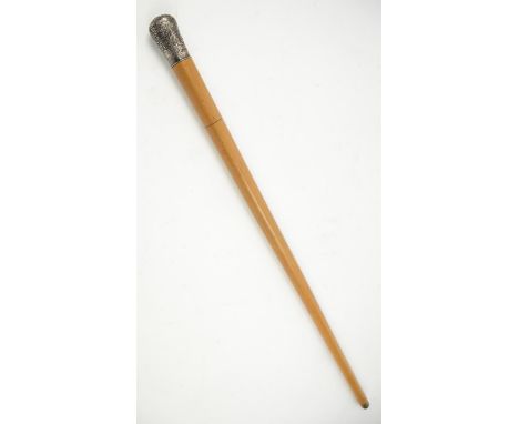 Late 19th century malacca swordstick, the white metal handle with embossed scrolling decoration, 86.5cm long,