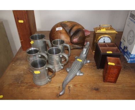 A quantity of pewter tankards; a nutcracker in the form of a crocodile; a wooden ornament in the form of a sleeping cat, leat