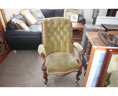 A Victorian mahogany button back arm chair 