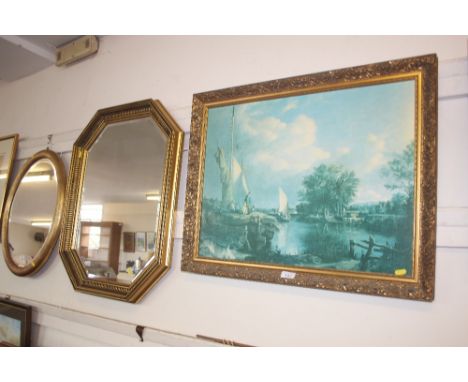 An octagonal framed bevel edged wall mirror; together with a gilt framed print 