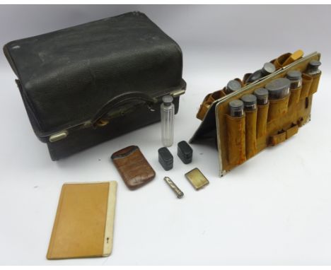 Victorian leather Gladstone bag style travelling case, interior fitted with glass and silver mounted toilet bottles, hip flas