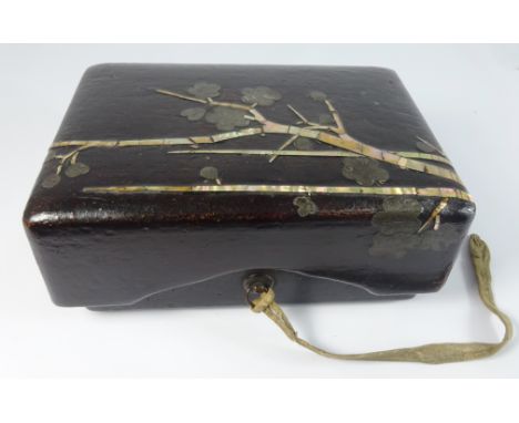 Japanese 19th Century black brown and mother of pearl rectangular box and cover decorated with flowering branches 19cm wide -