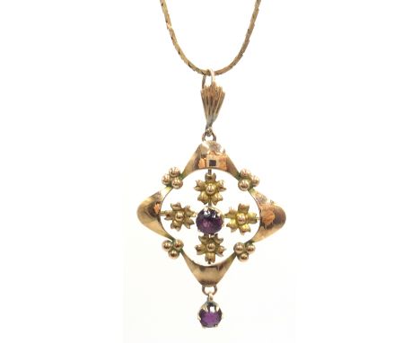 9ct gold pendant, floral design set with two amethysts on a fine link neck chain halllmarked Condition Report & Further Detai