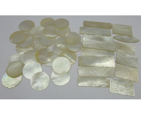 Twenty eight Oriental mother of pearl gaming counters with engraved decoration and fourteen rectangular and oval counters  Co