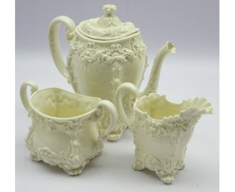 Late Victorian Royal Worcester coffee pot with floral moulded decoration on white glazed ground, with matching two handle sug