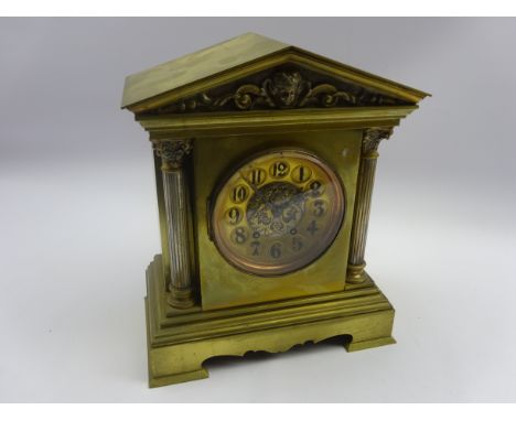 Early 20th century mantle clock with black numerals and gong strike in brass architectural style case with arched pediment H3