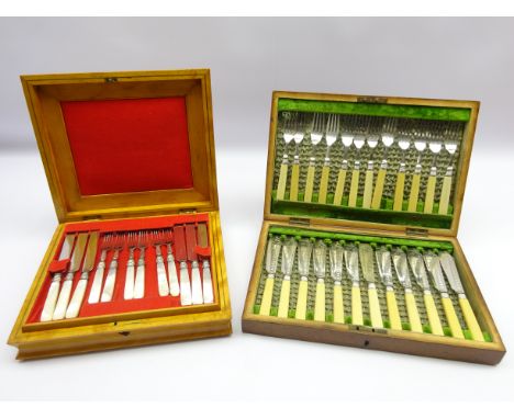 Set of eighteen dessert knives and forks with mother of pearl handles and plated blades, cased and a set of twelve fish knive