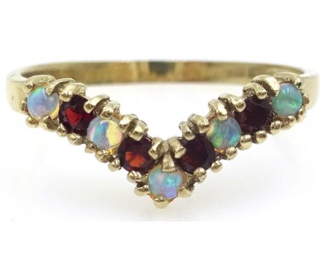 9ct gold garnet and opal wishbone ring, hallmarked Condition Report & Further Details Click here for further images, conditio