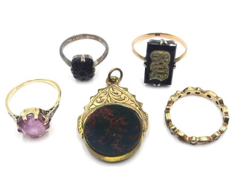 Victorian gold hardstone swivel fob stamped 9ct, gold stone set ring stamped 18ct, two 9ct gold rings and one other Condition