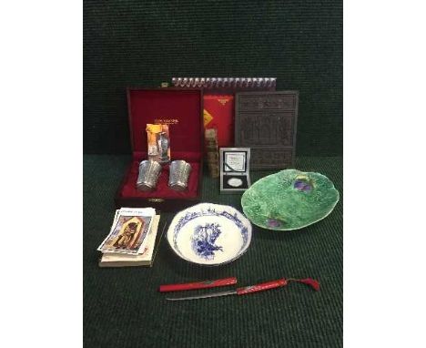 A tray of boxed commemorative silver Panda coin, postcards, oriental tea brick, pair of boxed pewter beakers etc