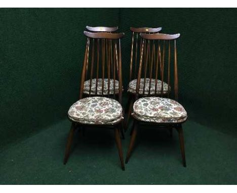 A set of four Ercol high backed dining chairs