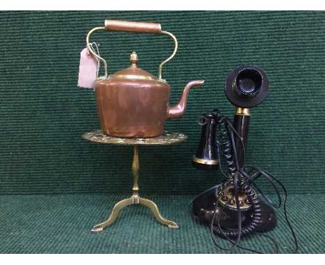 A reproduction candlestick telephone, brass and copper kettle and a brass trivet depicting a squirrel 