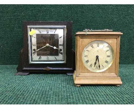 An oak cased Art Deco mantel clock and a pine cased mantel clock 