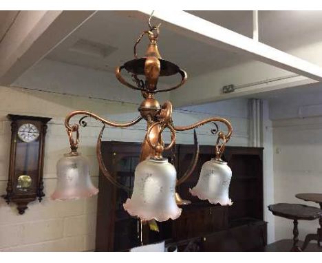 An Arts and Crafts copper light fitting in the style of W A S Benson