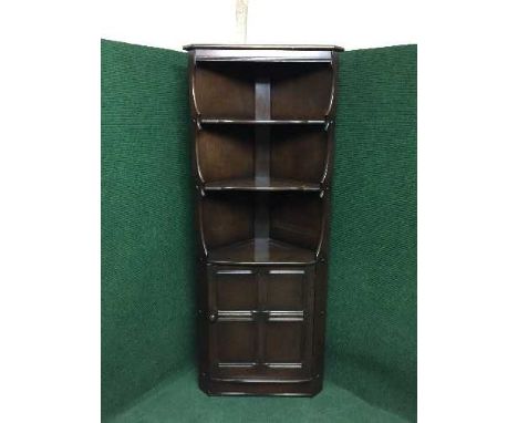 An Ercol corner cabinet